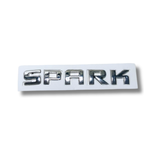 EMBLEMA INYECTADO CHEVROLET SPARK TRASERO LETRAS ADHESIVAS CROMADO