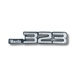 EMBLEMA INYECTADO MAZDA 323 T.O